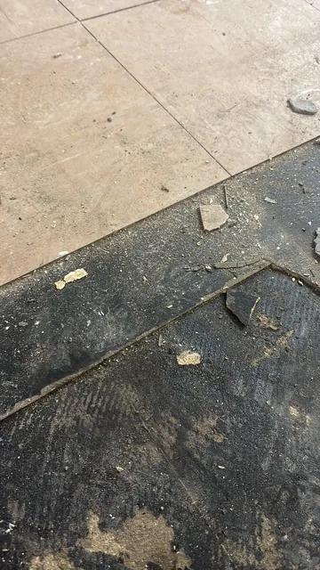 Black bitumen mastic floor removal in a SW5 flat